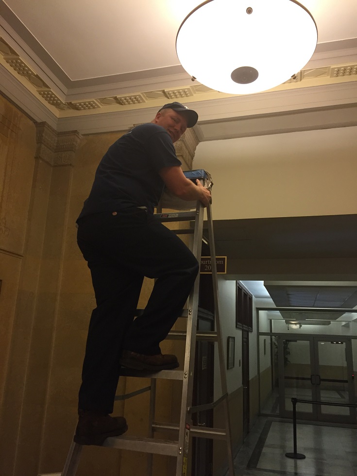 Sharkey on Ladder at Courthouse East